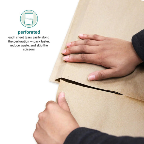 Brown Kraft Packing Paper Sheets For Moving And Shipping 1500 Count 1375 Feet Total 14.5 By 11 Inch Sheets being torn along perforation
