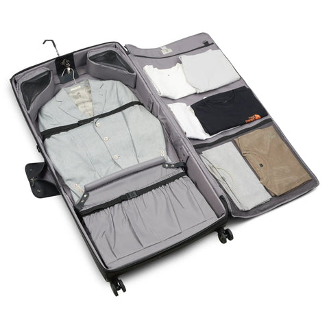 Front view of a gray rolling garment bag with spinner wheels, opened to reveal a suit, shirts, and mesh pockets.