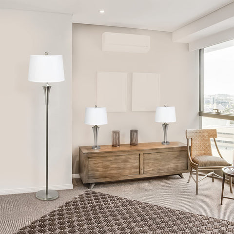 Room setup with Tapered 3 Lamp Set With White Fabric Shades In Brushed Nickel, 1 floor lamp and 2 table lamps on a wooden console