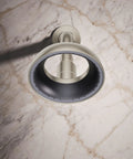 Statement VES Single-Function Showerhead 1.5 GPM Vibrant Brushed Nickel, wide coverage spray, facing upward on marble surface