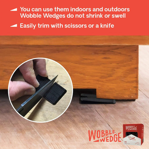 Wobble Wedges Flexible Plastic Shims 30 Pack for Home Improvement and DIY Projects Black Leveling Spacers for Tables Furniture Toilets Beds and More Made in USA being trimmed and used under furniture.