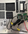 8 Gang Electronic Switch Panel For 12V Systems With LED Indicators and Remote Control, various components on a table.