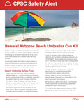 Colorful beach umbrella on sandy beach with safety alert text.