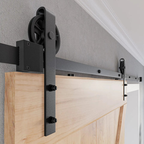 Heavy Duty Sliding Barn Door Hardware Kit With Reinforced Steel Rollers And Silent Tracks, close-up of matte black rollers and track.