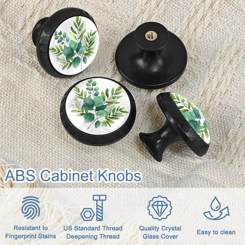 Set of 4 Sage Green Eucalyptus Leaves Drawer Knobs in Black Finish for Kitchen Cabinets and Bathrooms, on fabric surface