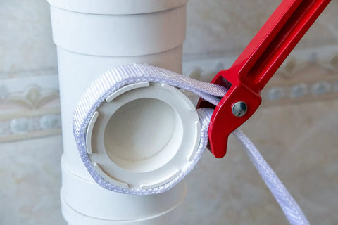 12 Inch Handle Strap Wrench With No Slip Adjustable Nylon Strap For Tight Spaces Oil Filter And Pipe Wrench in use on pipe