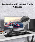 Two Pack Ethernet Couplers To Extend Your Cables Female To Female RJ45 on desk connecting PC and monitor