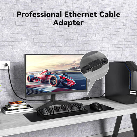 Two Pack Ethernet Couplers To Extend Your Cables Female To Female RJ45 on desk connecting PC and monitor