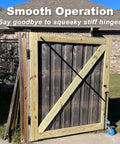Joytrace 7-inch gate hinges mounted on a wooden exterior gate with diagonal brace and black hardware