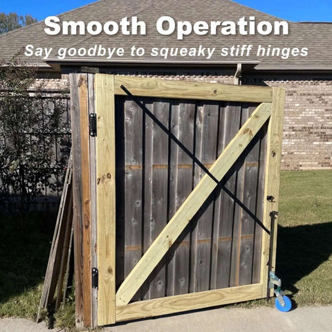 Joytrace 7-inch gate hinges mounted on a wooden exterior gate with diagonal brace and black hardware