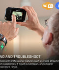 Person using C5 Compact Thermal Imaging Camera With WiFi, High Resolution Infrared Imager for Quick Checks in a room setting.