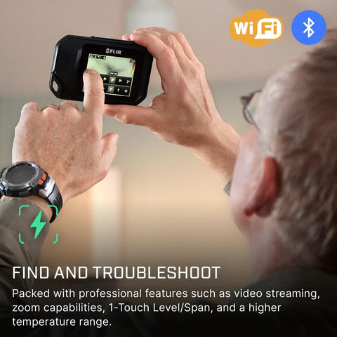Person using C5 Compact Thermal Imaging Camera With WiFi, High Resolution Infrared Imager for Quick Checks in a room setting.