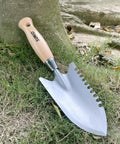 11.6 Inch Weeding Trowel With Serrated Edge Alloy Steel Blade Garden Shovel on grass surface near tree