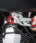 Using 10 Inch Pliers Wrench With Comfort Grip, Adjustable Push Button Jaw on motorcycle engine for mechanical repairs