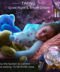 Child asleep with Moon Galaxy Lamp Night Light For Kids With 16 Colors 3D LED Moon With Stand Remote And Touch Control in bedroom.
