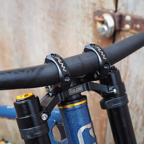 RSX Direct Mount Mountain Bike Stem for 31.8mm Bars, black lightweight split design on dual crown forks, close-up view