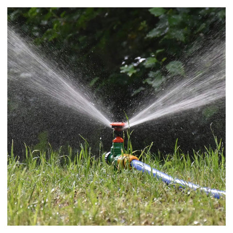 360 Degree Rotating Killer Sprinkler Set For Lawn And Garden Irrigation spraying water on grass with half inch nozzle