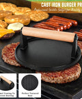 Camping Ready 27 Piece Griddle Accessories Kit For Flat Top Grills With Melting Dome Includes Long Spatula Slotted Spatula Extra Wide Spatula Tongs Burger Press Basting Brush Egg Rings Shakers Squeeze Bottles And More For Outdoor BBQs, featuring a cast iron burger press on a griddle with burgers and sausages.