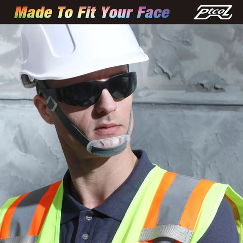 Badass Bulk Pack Safety Glasses Polycarbonate Lenses Black Tinted Antiscratch Impact Resistant ANSI Certified work goggles worn by worker.