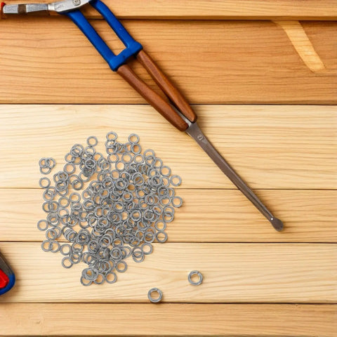 200 Pack Stainless Steel Lock Washers For Bolts And Screws Round Flat Spring Washers with tool on wooden surface