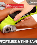 Creddux Cordless Electric Scissors, 4.2V Rechargeable Power Cutter cutting through brown leather fabric effortlessly.