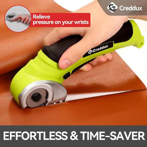 Creddux Cordless Electric Scissors, 4.2V Rechargeable Power Cutter cutting through brown leather fabric effortlessly.