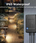Image of All In One LED Low Voltage Landscape Lighting Kit 12 Pack With 60W Transformer showing waterproof transformer and pathway lighting in rain.