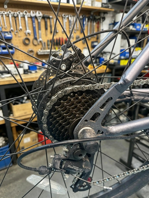 Rear view of bike with All In One Bike Chain Kit With 126 Links For 6/7/8 Speed Chains, Built In Chain Tool, Replacement Set