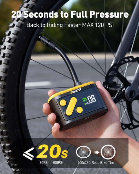 Hand using Mini Bike Pump With Gauge Auto Stop 120 Psi Portable Hand Pump For Mountain And Road Bikes Presta Schrader Valves Fast 20s Inflation Tiny Pocket Tire Inflator On The Go For Bicycles And Balls on a bike tire