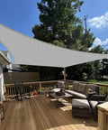 13 Foot by 13 Foot Sun Shade Sail Rectangle Canopy over patio with outdoor furniture, UV block, gray color