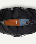Massive Capacity Extra Large Foldable Nylon Duffle Bag For Travel And Storage With Zippered Pockets 150 Liter, open view showing contents.