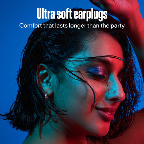 PartyPlug Pro Natural Music Ear Plugs For Concerts Parties And Festivals shown worn by person with colorful lighting