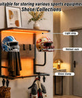 Badass Motorcycle Helmet Rack Wall Mount Featuring Remote Controlled RGB Ambient Light Strip For Grease Monkey Gear Storage With Solid Wood And Steel Build System displaying helmets, light strip, and glove clamp.
