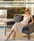 Woman relaxing on 5 Piece All Weather Patio Set With Wicker Chairs And Coffee Table High Back Swivel Rockers Modern Rattan Outdoor Conversation Set