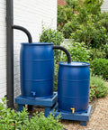 Blue rain barrels with hose connector kit and downspout diverter links rainwater overflow and stores more water in garden