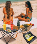 Ultralight Foldable Camping Side Table With Aluminum Build on beach with drinks, snacks, and carry bag, ideal for outdoor adventures
