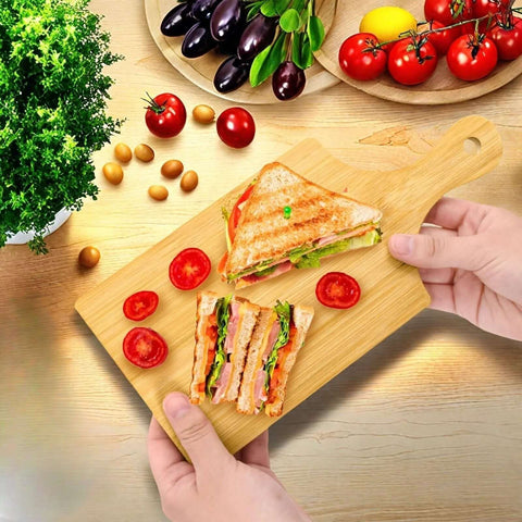 YIMITEE bamboo cutting board with handle, natural wood, 11x5 in; front view with two sandwiches on board.