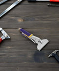 Sheet Metal Hand Seamer Pliers With Straight Jaw And Ergonomic Non Slip Grip for HVAC repairs, on a wooden workbench.