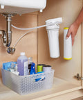 Hand installing Top Notch Single Stage Drinking Water System Replacement Filter For GX1S01R under sink.