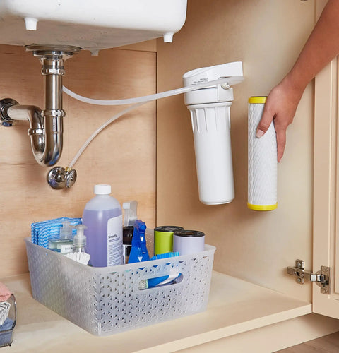 Hand installing Top Notch Single Stage Drinking Water System Replacement Filter For GX1S01R under sink.