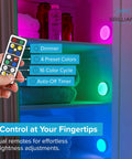 Remote controlling Wireless RGB LED Puck Lights Kit With Remotes For Under Cabinet Shelves And Walls Battery Operated Color Changing And Fade Modes 55 Lumens Per Light Easy Adhesive Or Screw Mount 6 Pack in a colorful cabinet display.