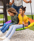 700 Lb 40 Inch Rainbow Saucer Tree Swing For Kids And Adults Outdoor, two children swinging on colorful Textilene fabric