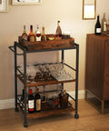Kickback Ready Three Tier Kitchen Cart With Smooth Rollin Wheels Rustic Brown Multi Purpose Bar Serving Stand Roomy Open Shelves displaying drinks and glasses.