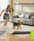 Girl and dog on rug displaying Rug Pad Gripper 5X Non Slip Power Grip For Area Rugs On Hardwood Floors And Carpets, 2x8 ft.