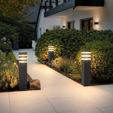 Premium Hardwired E26 Outdoor Pathway Light With Matte Black Finish And Elegant Walkway Lantern For Upgraded Yard Ambiance Plus No Fuss Zero Hassle Garden Glow Vibes illuminating a pathway with soft light.