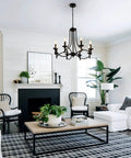 Industrial Candle Chandelier In Black Iron With Eight Lights in modern farmhouse living room.
