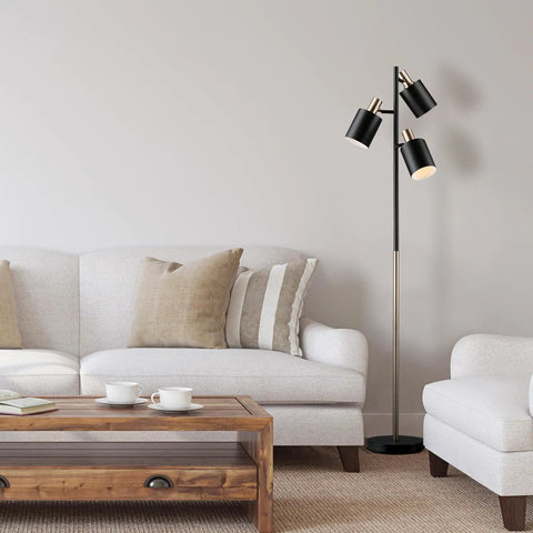 Lexie 67 Inch Floor Lamp With 3 Pivoting Heads In Matte White Finish And Antique Brass Accents in a modern living room scene