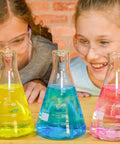 Kids experimenting with True Color Fizzers Tub Tint Tablets Pack For Water Coloring One Tablet Colors Up To A Liter in beakers