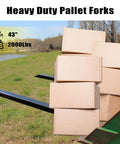 Clamp On Pallet Forks For Tractor Bucket With Adjustable Stabilizer Bar, 43 Inch Length, supporting boxes in field
