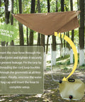Portable Rainwater Collection System For Camping With A 5 By 5 Foot Hanging Tarp And A 2.2 Gallon Collapsible Water Bag in forest